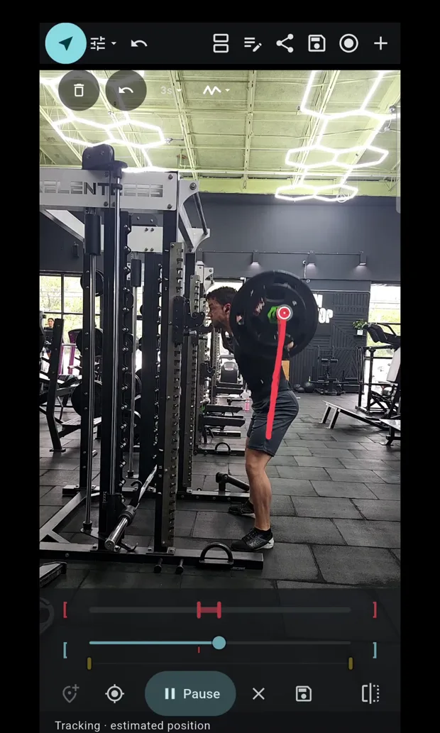 A barbell squat in InForm with a red tracked path drawn up from the plate, showing where the bar travelled through the lift.
